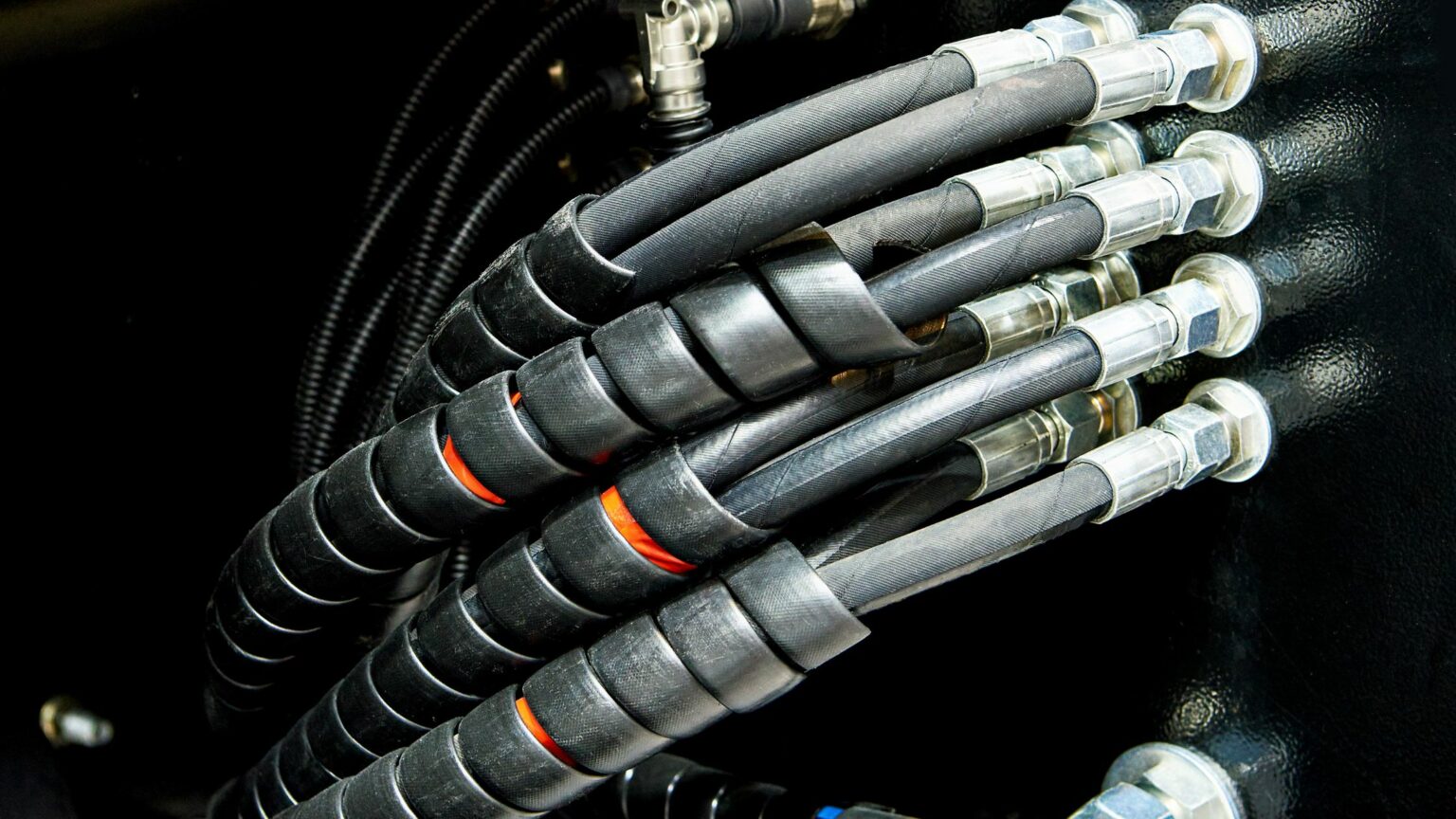 A picture of black hydraulic hoses.